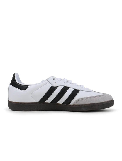 Adidas Samba OG sneaker side view with white upper, black stripes, suede toe, and gum sole.