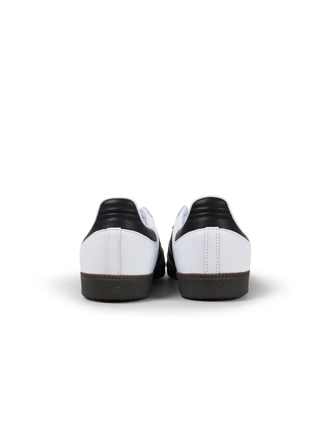 Adidas Samba OG sneakers viewed from the heels, with black heel tabs and gum soles.