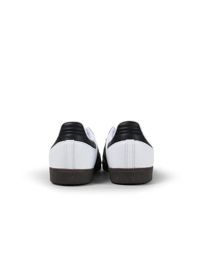 Adidas Samba OG sneakers viewed from the heels, with black heel tabs and gum soles.